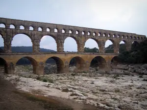 Pont du Gard bridge - Roman aqueduct (ancient monument) with three floors of arcades (arches); in the town of Vers-Pont-du-Gard