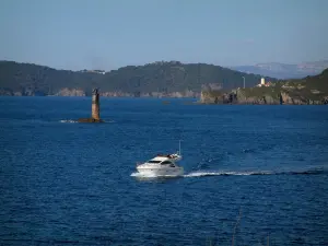 Porquerolles island - The Mediterranean Sea with a boat, wild coasts and forests