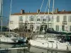 Ré island - Saint-Martin-de-Ré: sailboats in the port, quay, café terrace and houses