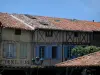 Revelar - Bastide medieval: fachadas de casas na praça central, em Pays de Cocagne