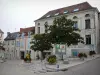 La Roche-Posay - Spa town: houses, place decorated with trees and flower tubs