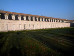 Rochefort - Lawn dotted with leaves and the royal Rope factory (building home to the International Sea Centre)