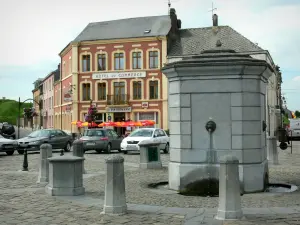 Rocroi - Fountain of the Place d'Armes square and facades of houses in the town