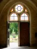 Royaumont abbey - Door of the monks' building (bâtiment des pères) with a view of the canal and the wooded park