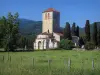 Saint-Just de Valcabrère basilica - Romanesque basilica, meadow, trees, cypress and Comminges hills