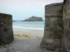 Saint-Malo - Fortifications of the corsair malouine town with view of the sandy beach, the sea and the National fort (bastion)