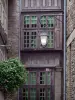 Saint-Malo - Walled town: lamppost, flowers and facades of houses in the old town (malouine corsair town)