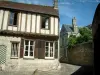 Senlis - Half-timbered house, paved street, stone wall and residence in background