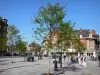 Valenciennes - Herbes marketplace planted by trees and houses of the city