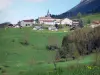 Vercors Regional Nature Park - Vercors mountains: view of the village of Rencurel with its houses and its church, pastures and trees