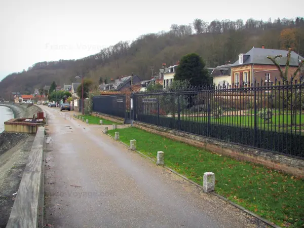 Villequier - Street running alongside the River Seine, houses of the village and trees, in the Norman Seine River Meanders Regional Nature Park